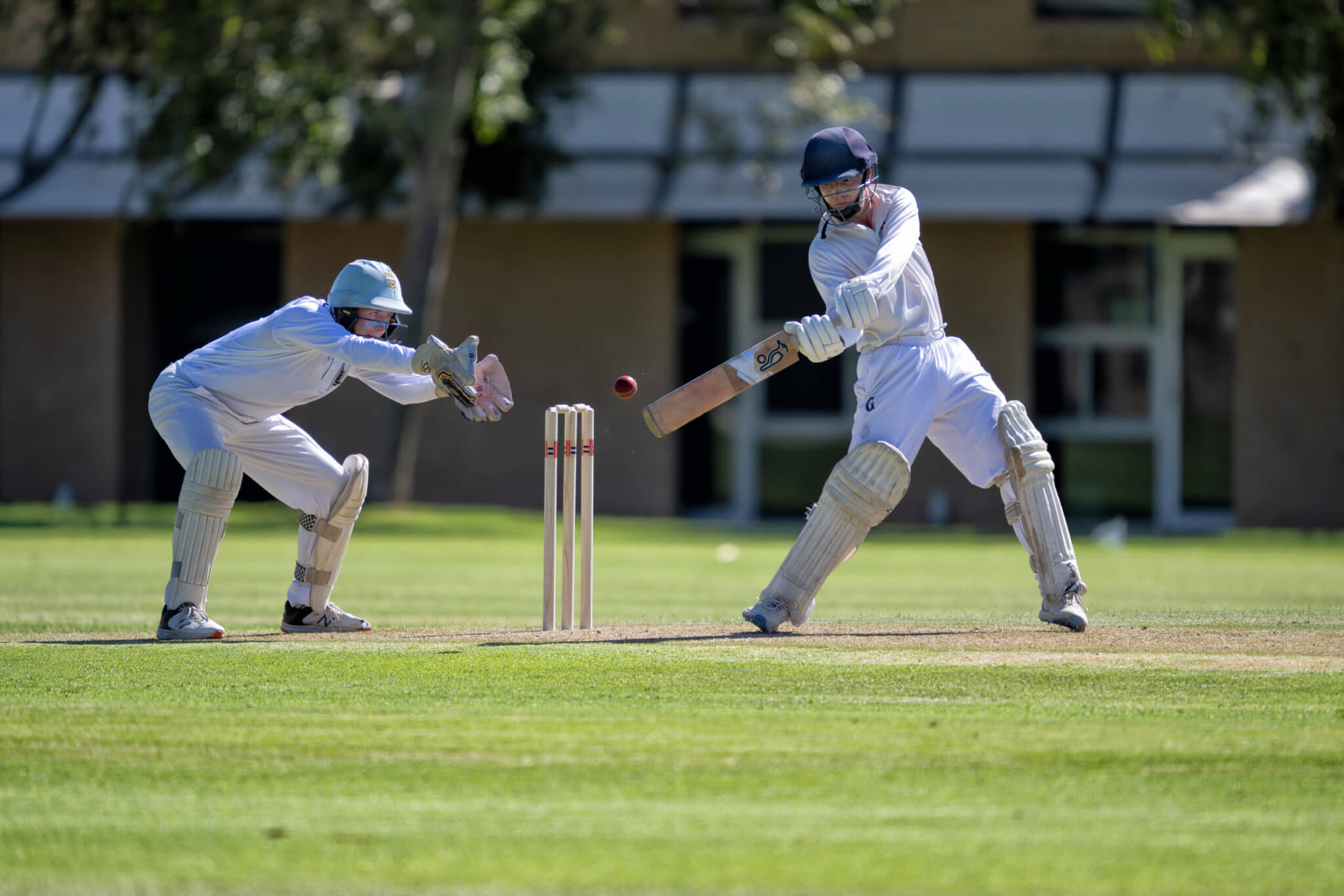 A GGS batsman plays a shot during a PSA Cricket match, summer season